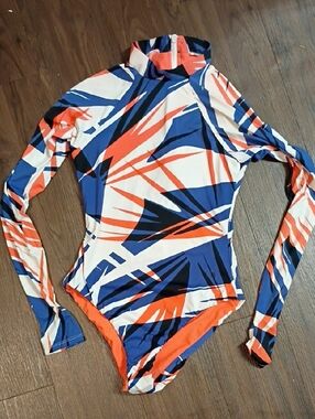 The Bikini Lab Long-Sleeve One-Piece Swimsuit in Blue, Orange & White